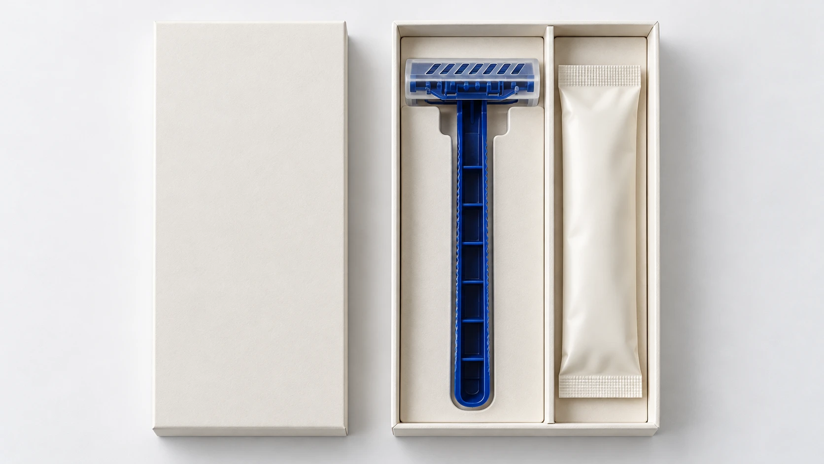 Compact disposable razor kit with a protective cap and separate shaving cream compartment